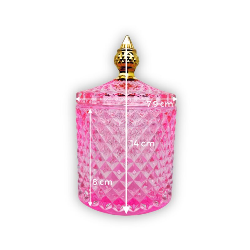 Pojemnik wraz z zakrętką do zalewu świec stojący na stole kolor różowy połysk