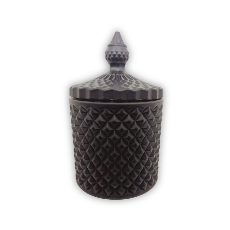 Pojemnik wraz z zakrętką do zalewu świec stojący na stole kolor czarny mat